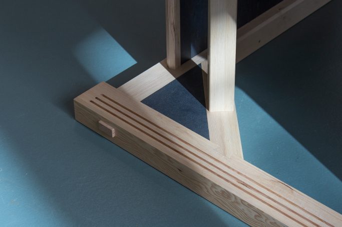 opened sliding doors of the museum desk reveal joinery detail on the inside