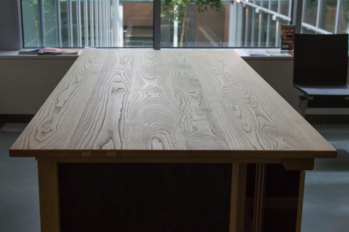 chestnut tabletop finished by Japanese handplane resulting in a glossy surface