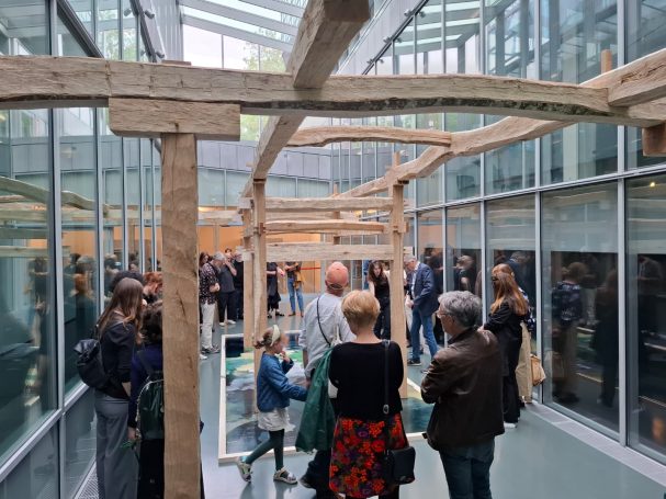 art installation timber frame with exhibition visitors